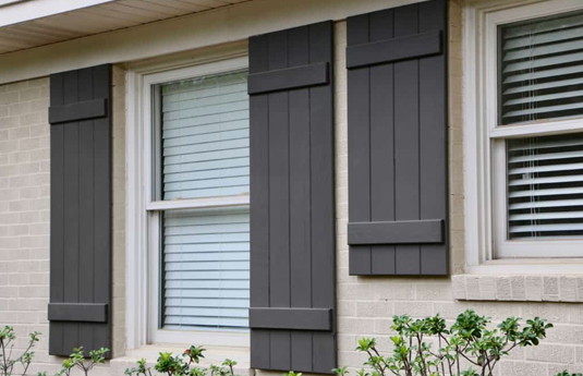 Board and batten shutters on a home